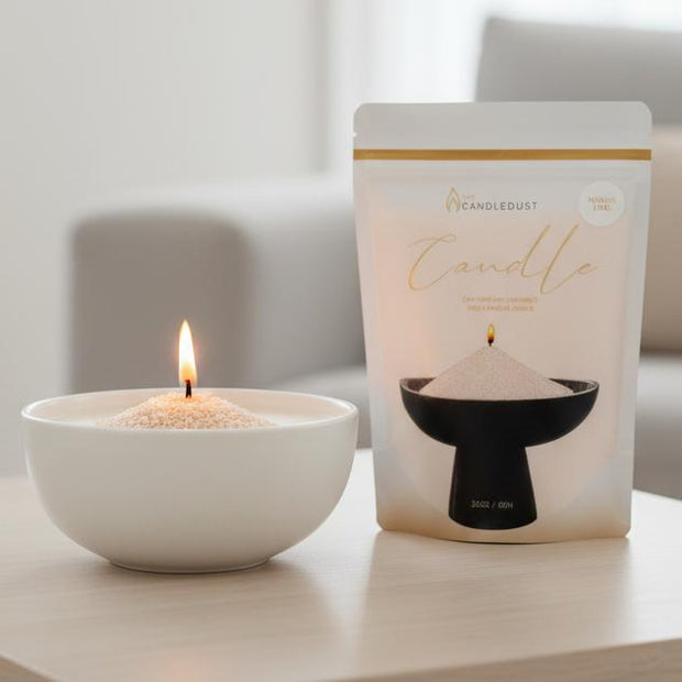 Nude Scented Candle Sand Kit – Mango And Lime, Mango and Lime candle-sand pouch beside a lit bowl