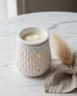 White ripple ceramic electric wax melt burner by Devon Wick, featuring a textured ceramic design and a small dish for wax melts.