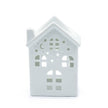 Ancient Wisdom White House oil wax melt burner with a white ceramic house-shaped design and tealight holder beneath.