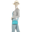 Tan brown Jamie Bags double zip crossbody bag with adjustable strap, featuring sleek design and multiple compartments.