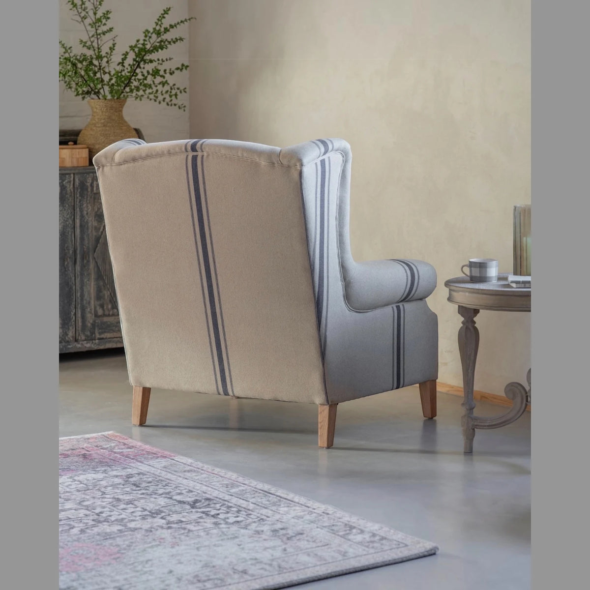 Monroe Blue Striped Large Armchair, rear angled view of the striped wingback armchair