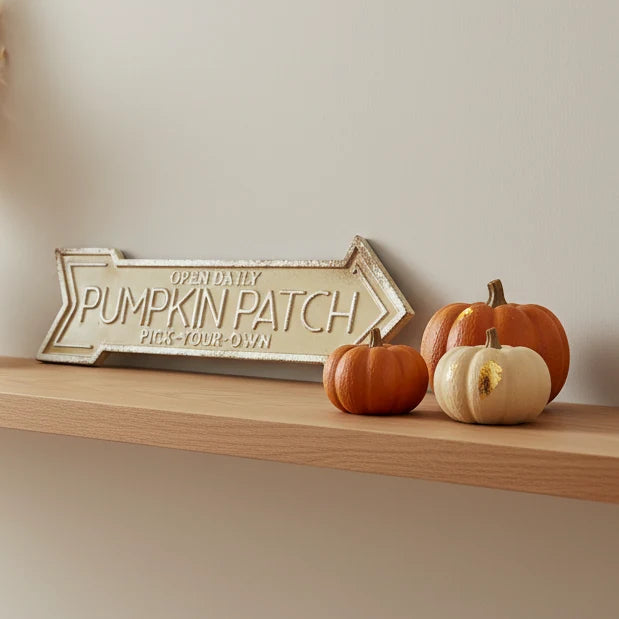 Large Gold Pumpkin Patch Arrow Sign, Pumpkin Patch arrow sign on a shelf with autumn pumpkins