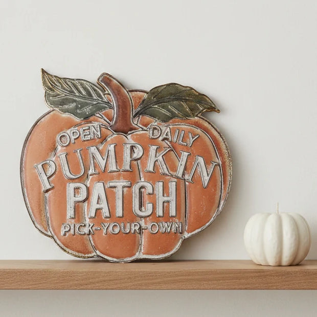Large Metal Open Daily Pumpkin Patch Sign, orange metal Pumpkin Patch sign on a shelf