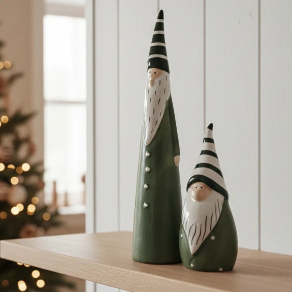 Sage Green And White Ceramic Gonk, green gonks with white beards and striped hats on a shelf
