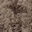 Brown faux fur cushion cover by Riva Home, soft and plush decorative throw pillow for cozy living room decor.