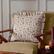 Beige linen cushion cover with filigree print and ruffle trim, soft furnishings by Riva Home, perfect for decorative accent.