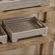 Wickham Rattan Rectangle Footed Tray, close-up of a woven footed tray on a wooden shelf