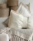 Cream neutral corduroy striped bow cushion by Starlight Express, featuring soft fabric and a charming bow design.