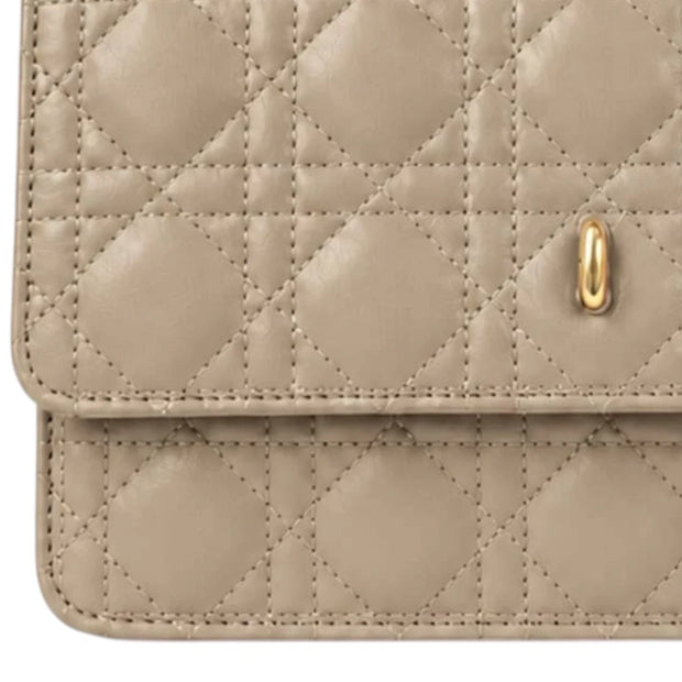 Beige Quilted Top Handle Crossbody Bag with Zip Closure, close-up of the beige quilting and gold-coloured clasp