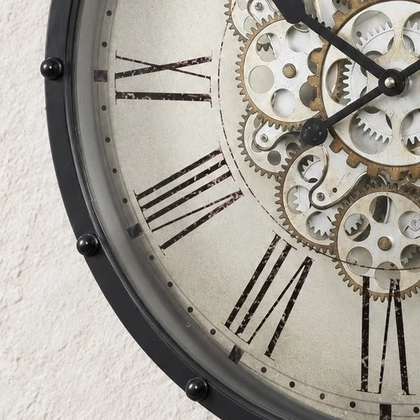 Black frame mechanical skeleton clock with visible gears and intricate design, showcasing a stylish and modern timepiece by Heaven Sends.