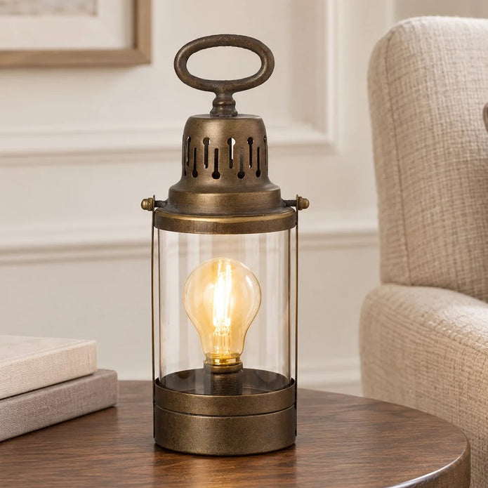 Rustic metal lantern for home decor by Heaven Sends, featuring a vintage design with glass panels and a handle for table or shelf display.