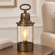 Rustic metal lantern for home decor by Heaven Sends, featuring a vintage design with glass panels and a handle for table or shelf display.
