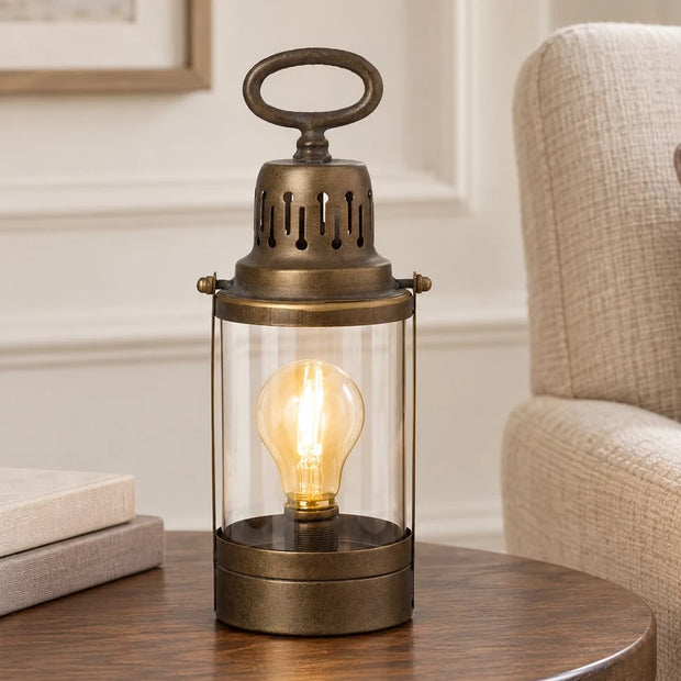 Rustic Metal Lantern, rustic metal lantern lamp with glowing bulb on a side table
