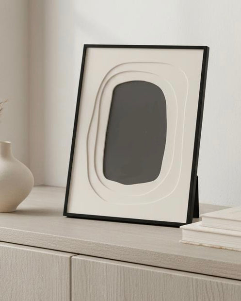 Wavy Black Colour Photo Frame White Border, black frame with cream wavy insert on a console