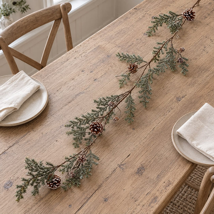 Pinecone garland on a wooden table