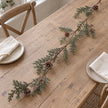 Pinecone garland on a wooden table