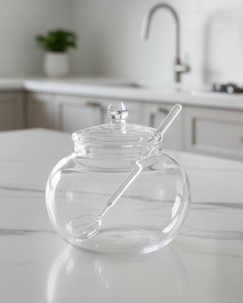 Glass Sugar Or Honey Pot And Spoon, empty round glass pot with lid and spoon on a counter