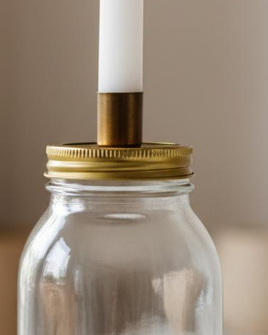 Ivory Candles In A Glass Storage Jar And Holder
