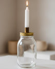 Ivory Candles In A Glass Storage Jar And Holder