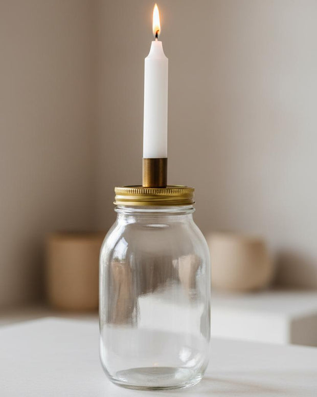 Ivory Candles In A Glass Storage Jar And Holder