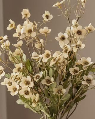 Cream artificial daisy flower stem from Starlight Express, featuring realistic blooms and green foliage for decorative use.