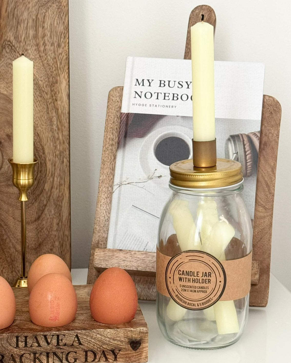 Ivory Candles In A Glass Storage Jar And Holder