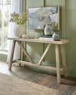Wooden console table from Hill Interiors' Haldon Collection, featuring a sleek design with a spacious top and sturdy legs.