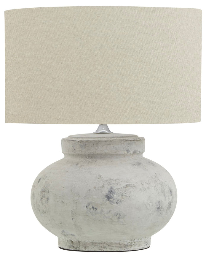 Hill Interiors Darcy squat round stone lamp with textured surface and warm lighting, perfect for stylish home decor.