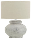 Hill Interiors Darcy squat round stone lamp with textured surface and warm lighting, perfect for stylish home decor.