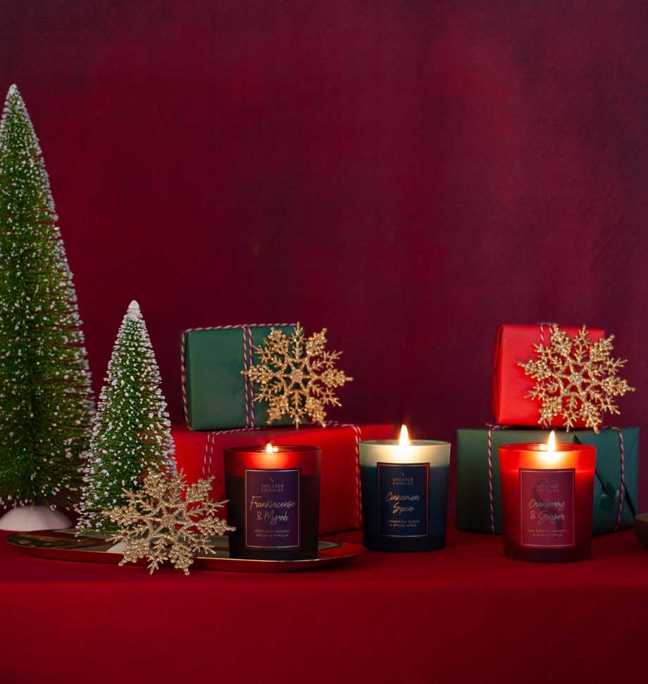 Shearer Candles Frankincense and Myrrh Christmas jar candle with festive holiday design and warm glowing wick.
