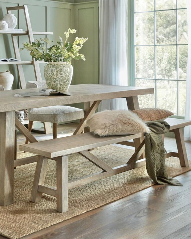 Large wooden dining bench from Hill Interiors' Haldon Collection, designed for comfortable seating in modern dining rooms.