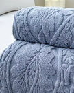 Ocean blue damask pattern fleece throw from Starlight Express, soft and cozy furnishings for added warmth and style.