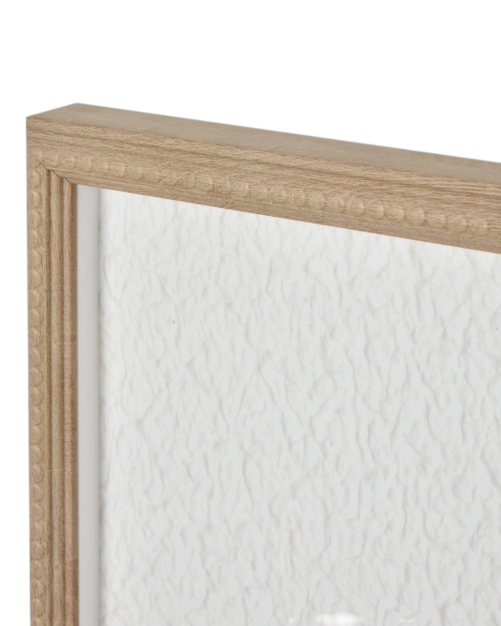 Large white feather print wall art in a frame by Hill Interiors, featuring elegant feather design on a neutral background.