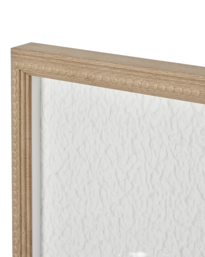 Large white feather print wall art in a frame by Hill Interiors, featuring elegant feather design on a neutral background.