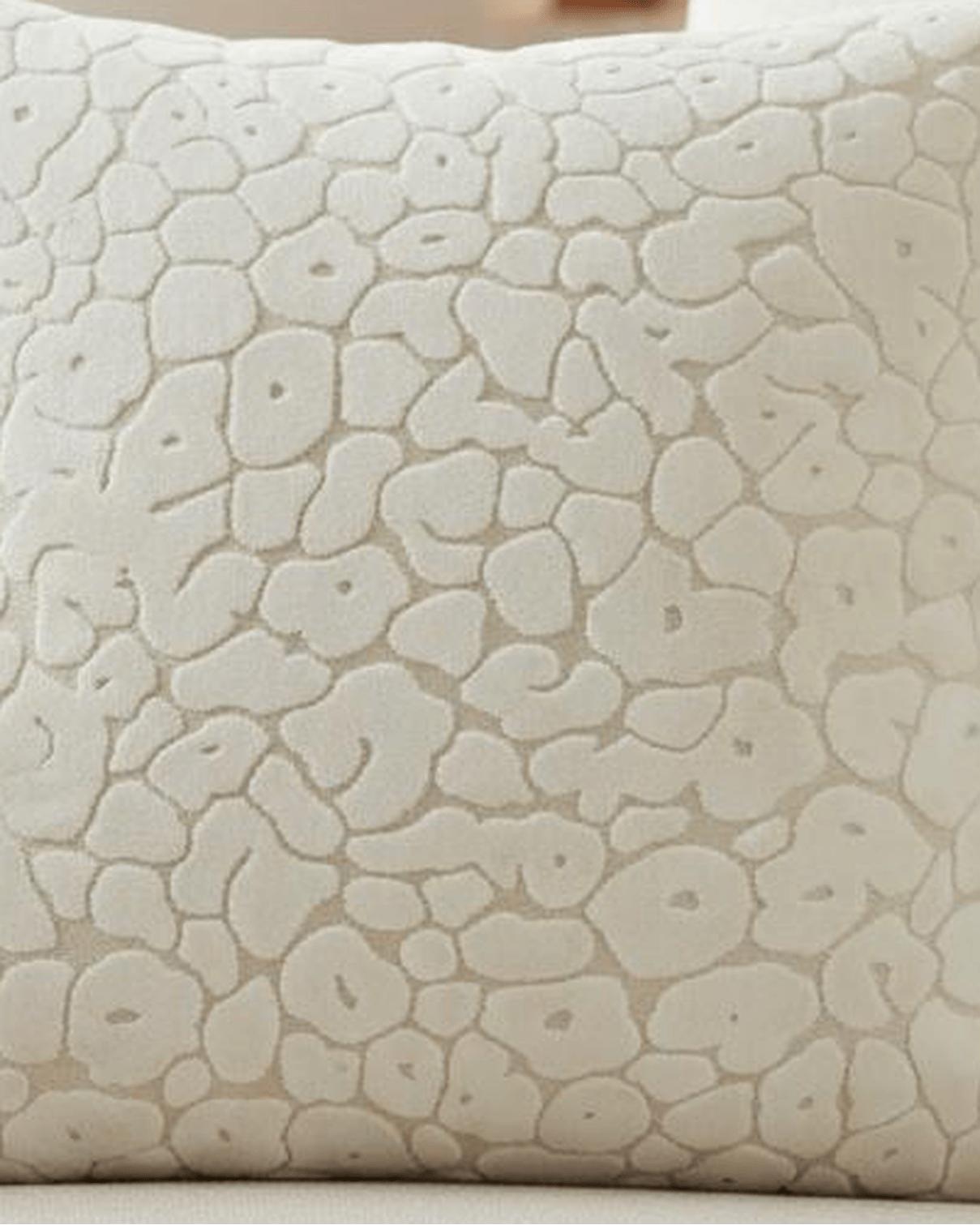 Neutral cream velvet cushion cover with leopard print pattern from Malini, showcasing soft, luxurious fabric and stylish design.