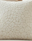 Neutral cream velvet cushion cover with leopard print pattern from Malini, showcasing soft, luxurious fabric and stylish design.