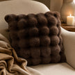 Chocolate Brown Luxury Faux Fur Cushion, chocolate brown faux fur cushion beside a lit candle