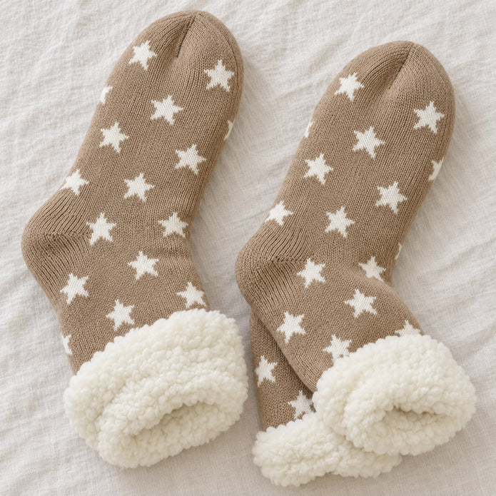 Cosy Slipper Socks - Beige Star, pair of beige star slipper socks on pale fabric