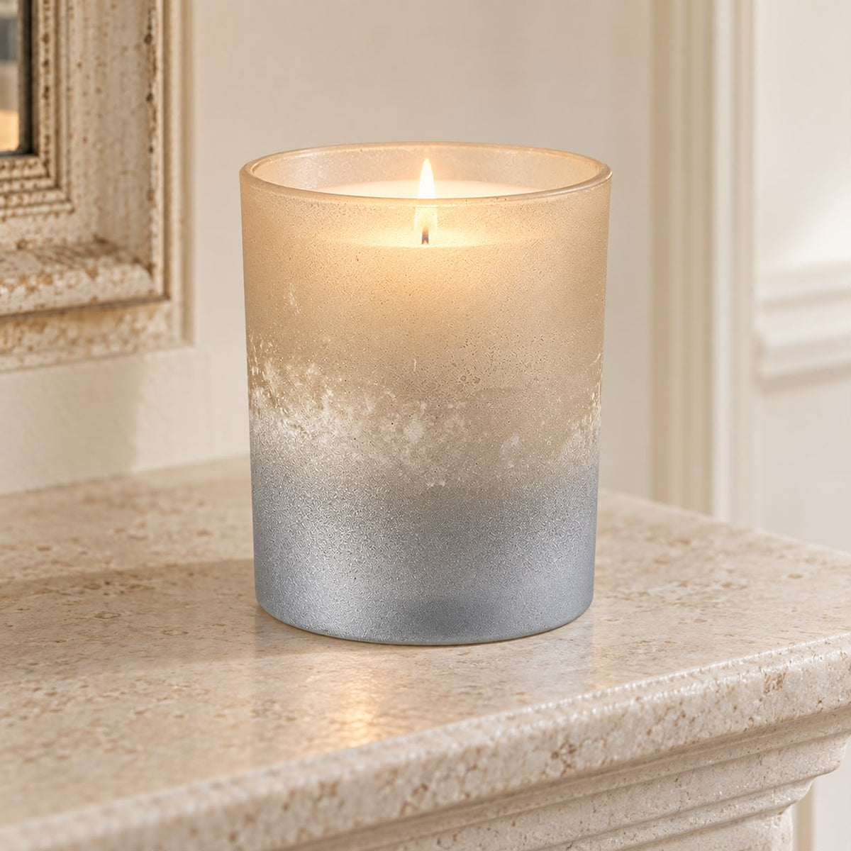 Faded Bronze Glass Tealight Holder, glowing bronze and silver glass holder on a stone mantel