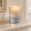 Faded Bronze Glass Tealight Holder, glowing bronze and silver glass holder on a stone mantel