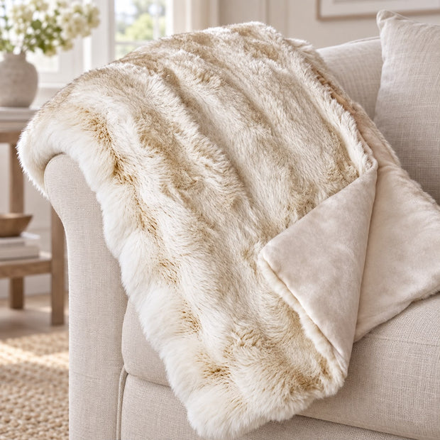 Cream Luxury Faux Fur Blanket Throw, close-up of the cream faux fur throw and smooth reverse on a sofa