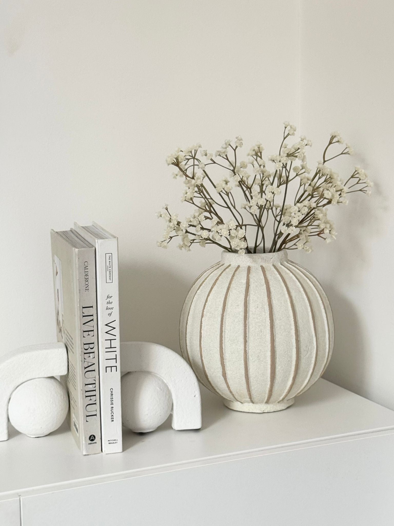 Decorative vase with globe and striped pattern, ideal for home décor from Hill Interiors.