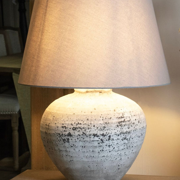 Large ribbed stone lamp by Hill Interiors, modern lighting fixture with textured stone finish for stylish interior illumination.