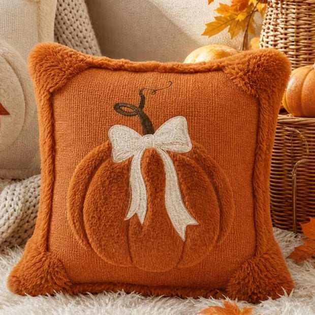 Orange Fluffy Pumpkin With Bow Cushion Cover, orange cushion with a pumpkin and cream bow beside autumn decor