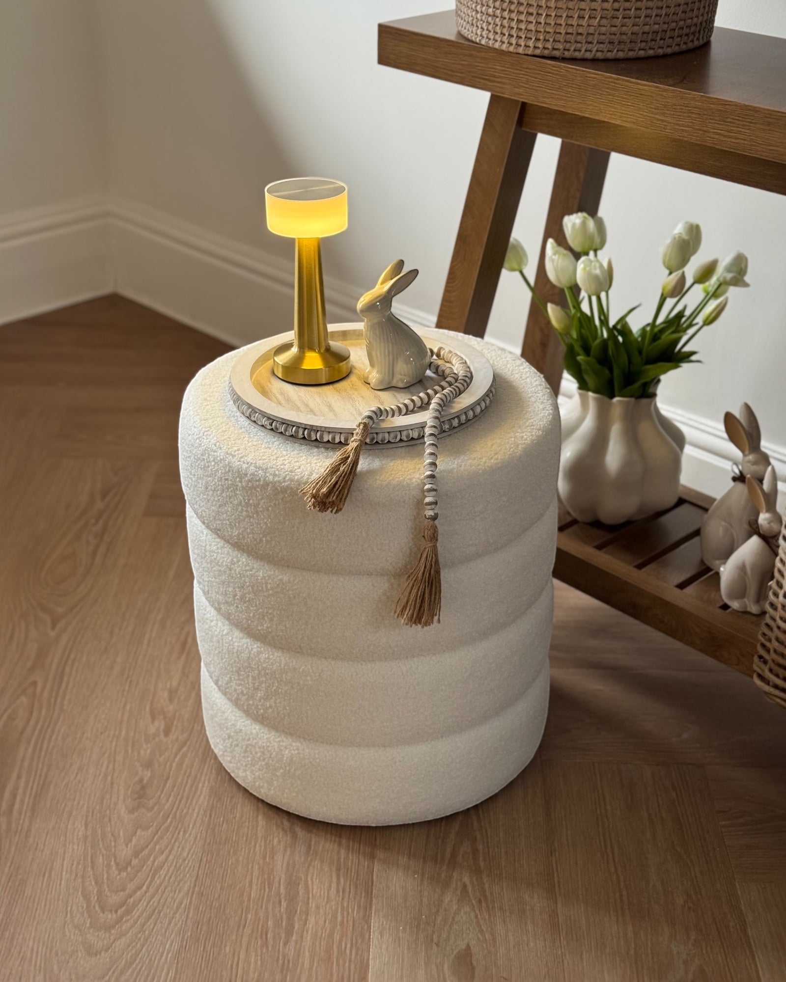 Cream boucle ribbed round foot stool from Starlight Express, featuring plush fabric and a modern, comfortable design.
