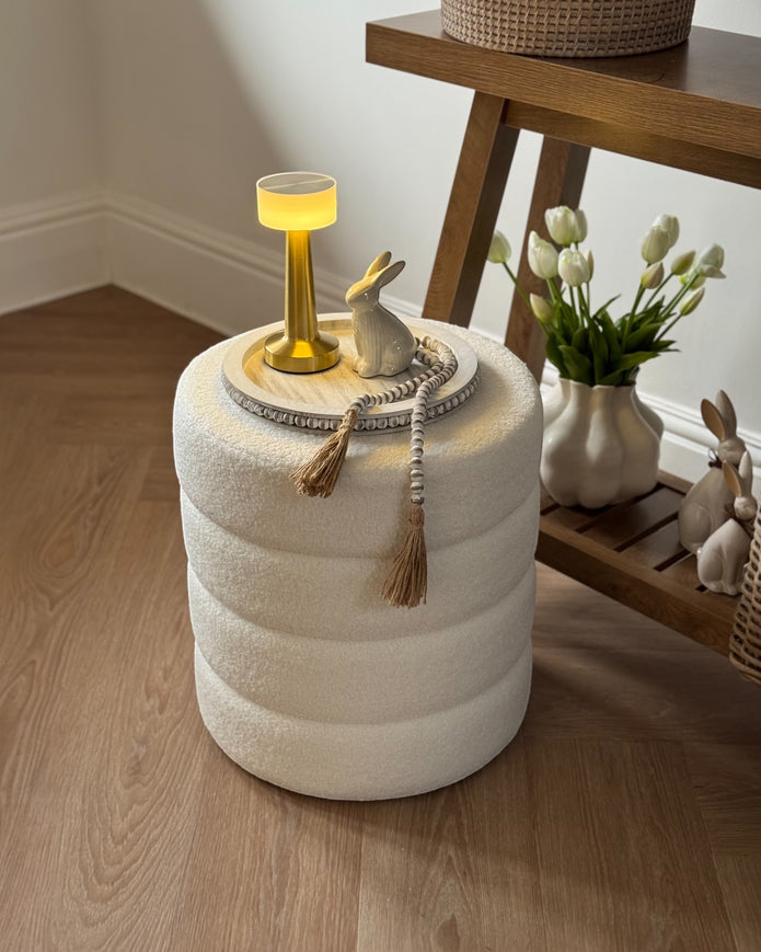 Cream boucle ribbed round foot stool from Starlight Express, featuring plush fabric and a modern, comfortable design.
