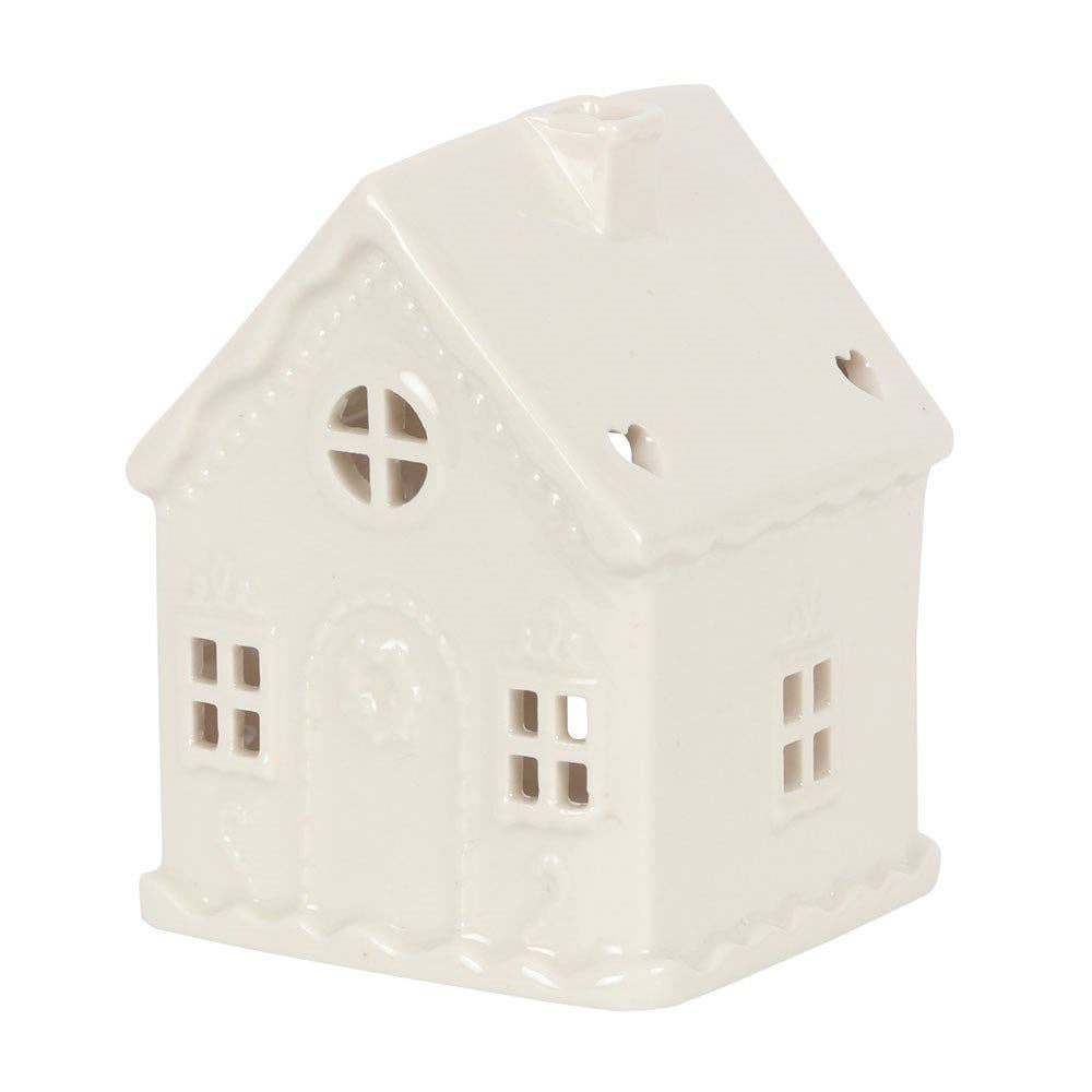 White Christmas gingerbread house tealight candle holder with festive holiday design, made by Something Different Wholesale.
