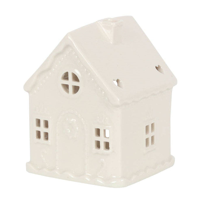 White Christmas gingerbread house tealight candle holder with festive holiday design, made by Something Different Wholesale.