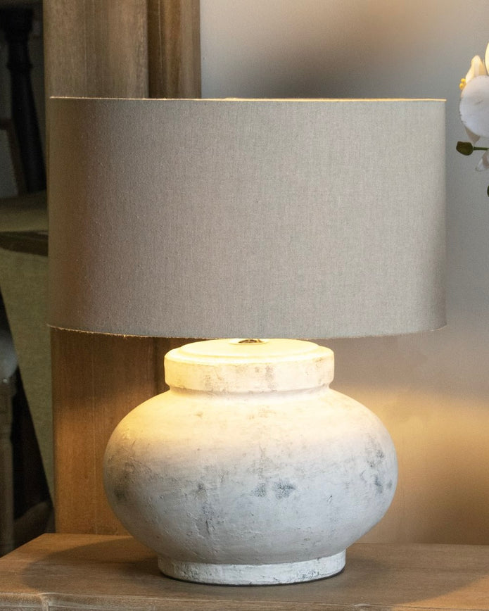 Hill Interiors Darcy squat round stone lamp with textured surface, modern lighting fixture for stylish interior decor.