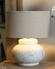 Hill Interiors Darcy squat round stone lamp with textured surface, modern lighting fixture for stylish interior decor.